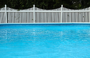 vinyl pool with white fence